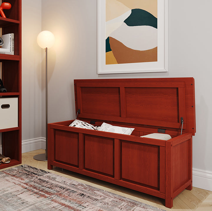 open top storage bench with open lid and pillows and blankets store inside