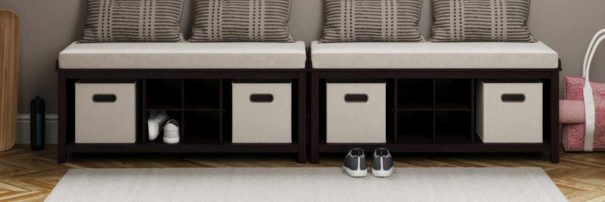picture of two entryway benches with cubby storage next to each other under a window