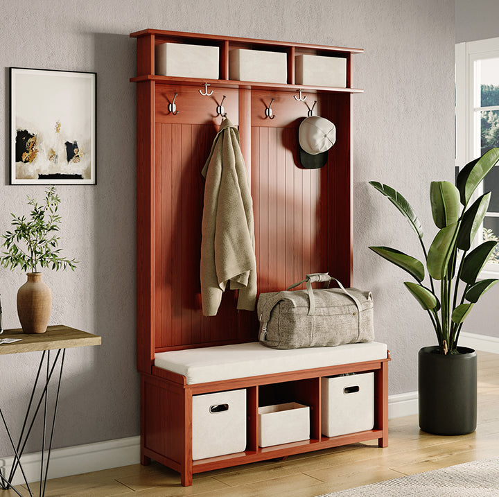 hallway  with a John Louis Home hall tree organizing coats and hats and other essentials 
