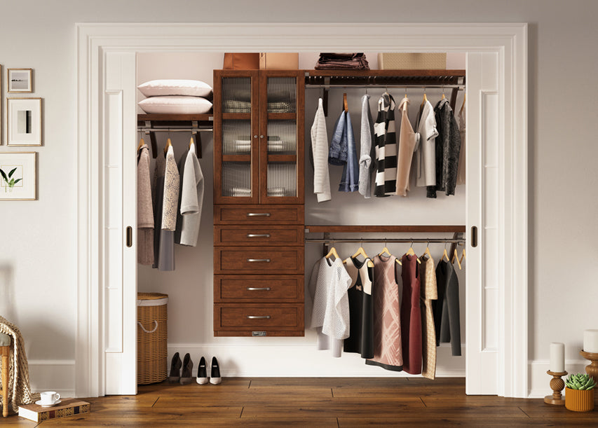 chestnut closet organizer with drawers and glass doors organizing items and clothes in a reach in closet