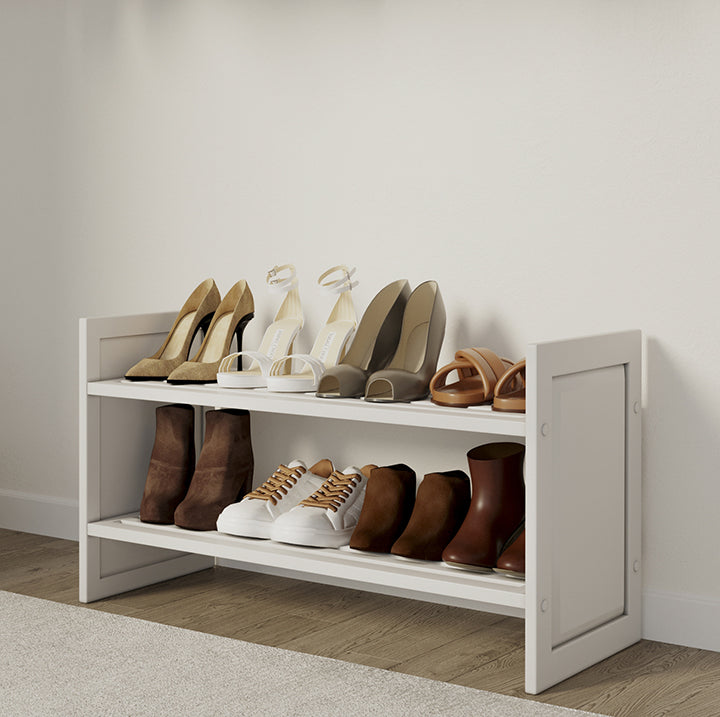 white John Louis Home stackable shoe and shelving rack used as a one tiered shoe rack in a walk in closet